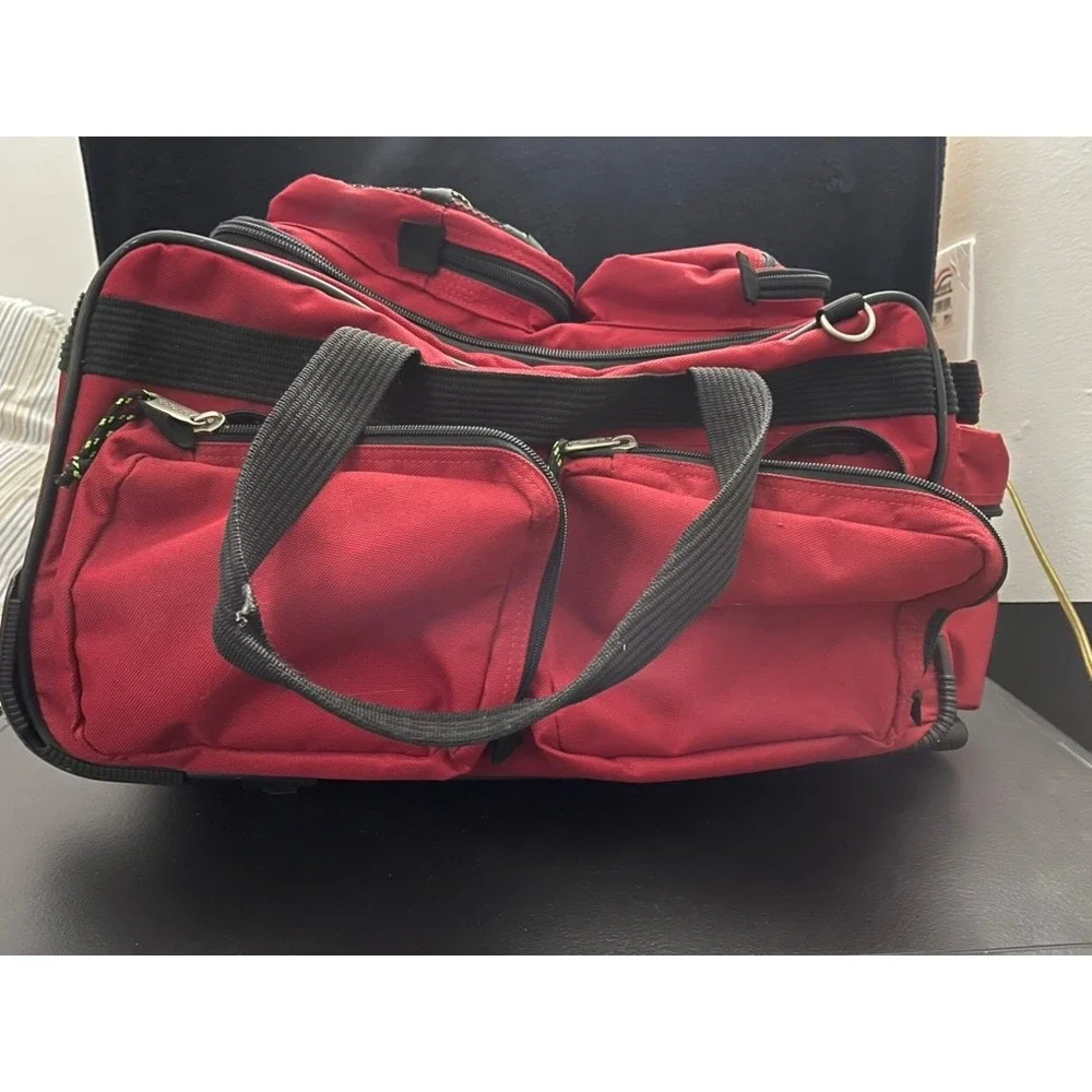 Olympia Sports Plus Red Rolling Duffel Bag Travel Luggage Retractable Handle